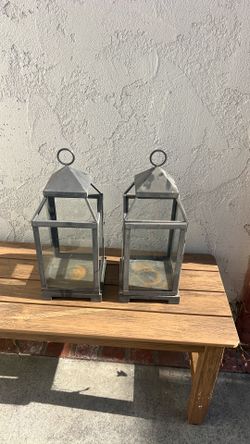 Set a two metal and glass lanterns – rustic coastal style