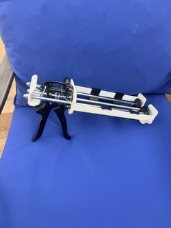Steel dispensing caulking gun