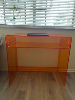 Orange acrylic desk