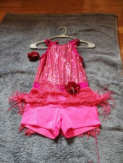 Dance costume pink, sequence and fringe, built in shorts, one oiece size 10-12