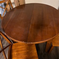 Round wood table with 4 chairs