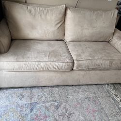 Tan pull out couch 