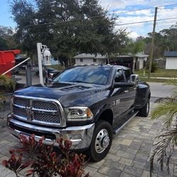 Pickup truck, trailer, three Dumpsters.