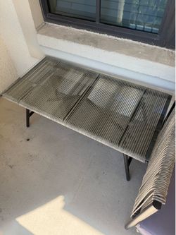 Rope patio chairs and glass coffee table