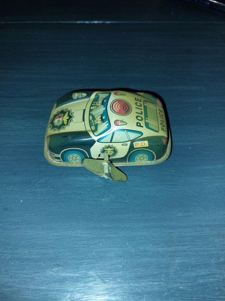 Antique wind up toy police car