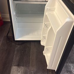 Tv and Small Refrigerator 