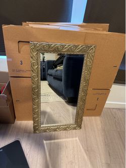 Mirror with gold trim