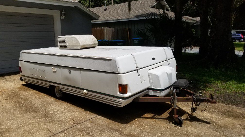 1995 Coleman pop up camper with AC sleeps up to 6