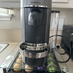 Nespresso machine with stand to store coffee pods