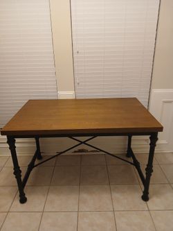 Wood table black metal accents