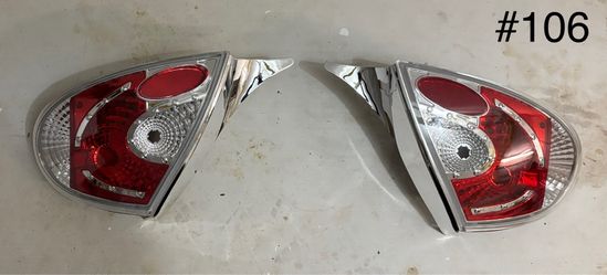 2000-2002 TYC Tail Lights Pair NEW Red/Clear