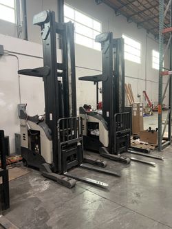 (2 Available) Crown RR Series Electric Stand-Up Rider Reach Trucks