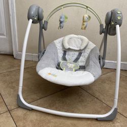 Ingenuity 6-Speed Portable Baby Swing with Music. 