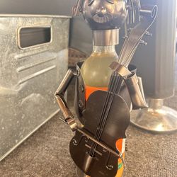 Cello player sculpture bottle holder