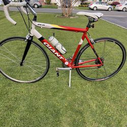 Very nice 55.5cm Giant OCR bike. It is red and white with a full Shimano gear train