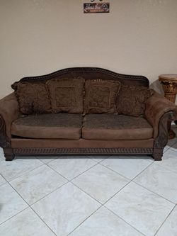 Traditional Brown Sofa with Carved Wood Frame