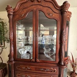 $1,300. Cherrywood dining table hutch, and six chairs.