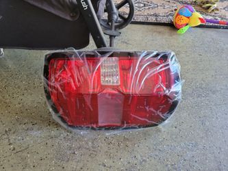 This is a passenger-side tail light assembly designed for a 2014-2018 Chevy Silverado 1500 or GMC Sierra.