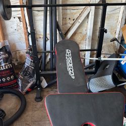 Weight Bench With 75lb Weights And Bench Press Bar And Leg Press