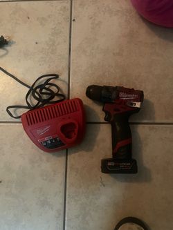 Milwaukee drill and battery charger