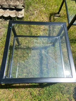 Three matching antiqued metal and glass tables in great condition