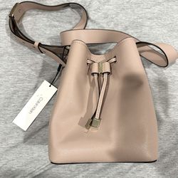 Calvin Klein brand pink pebbled leather adjustable bucket crossbody bag