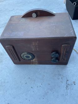 Vintage AM coin operated radio from dinner wooden