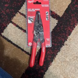 Multi purpose wire stripper with crimper