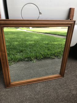 Excellent quality and vision mirror with wood frame size is 33x33 can deliver if need
