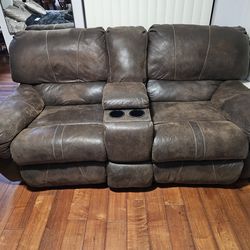 Two recliners with middle console