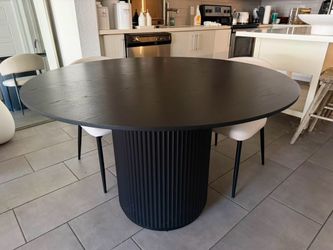 Black round dining table