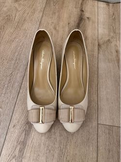 Designer’s Pump/ wedge size 7