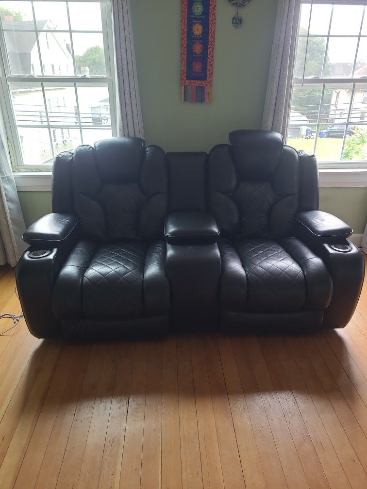 Do love seat retreat movie theater's style?3 compartment to store stuff.Two cup holders movie theater lights forth from Bobs discount furniture