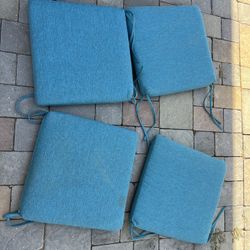 4 Piece Outdoor Patio Furniture Cushions in Teal Blue   Located in concord  Very good condition  No damages Covers not removable   Measures 18” x 18” 