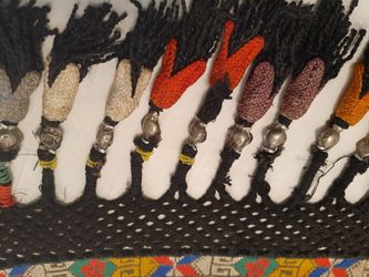 Amulet. Weaving. Ribbon with traditional ornament