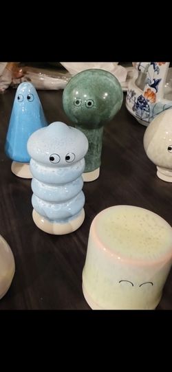 The items shown in the image are porcelain figurines from the Familia collection by Studio Arhoj, a well-known independent design studio based in Cope