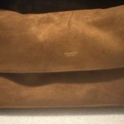 Suede Coach bag with horsey charm