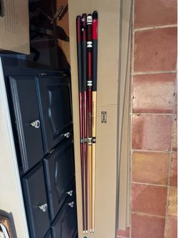 pool sticks (four)