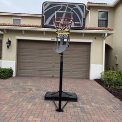 Basketball hoop with return attachment