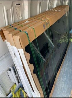 Brand New 115.5W x 95H PGT Vinyl Sliding Door with Frame.