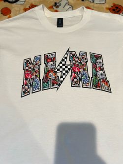 White Mama Tee with graphic featuring the word 'MAMA' with skulls, flowers, and a lightning bolt