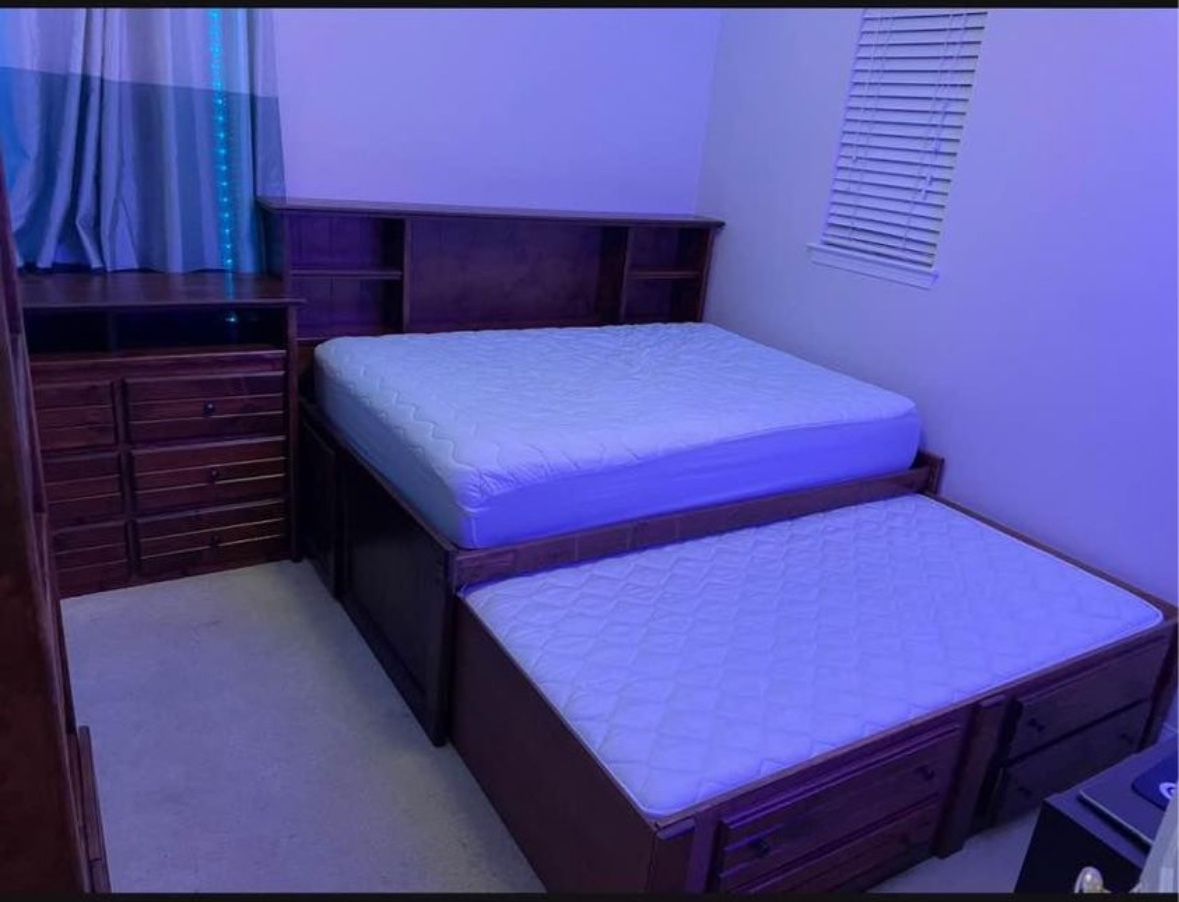 The bed set, the full size with a trundle twin bed, a dresser, a book shelf.