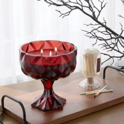 6" Faceted Coup Haunt Couture Glass Red Wax Filled 3-Wick Candle Goblet/Chalice. This object is a Faceted Coup Haunt Couture Glass Filled Red Wax Cand