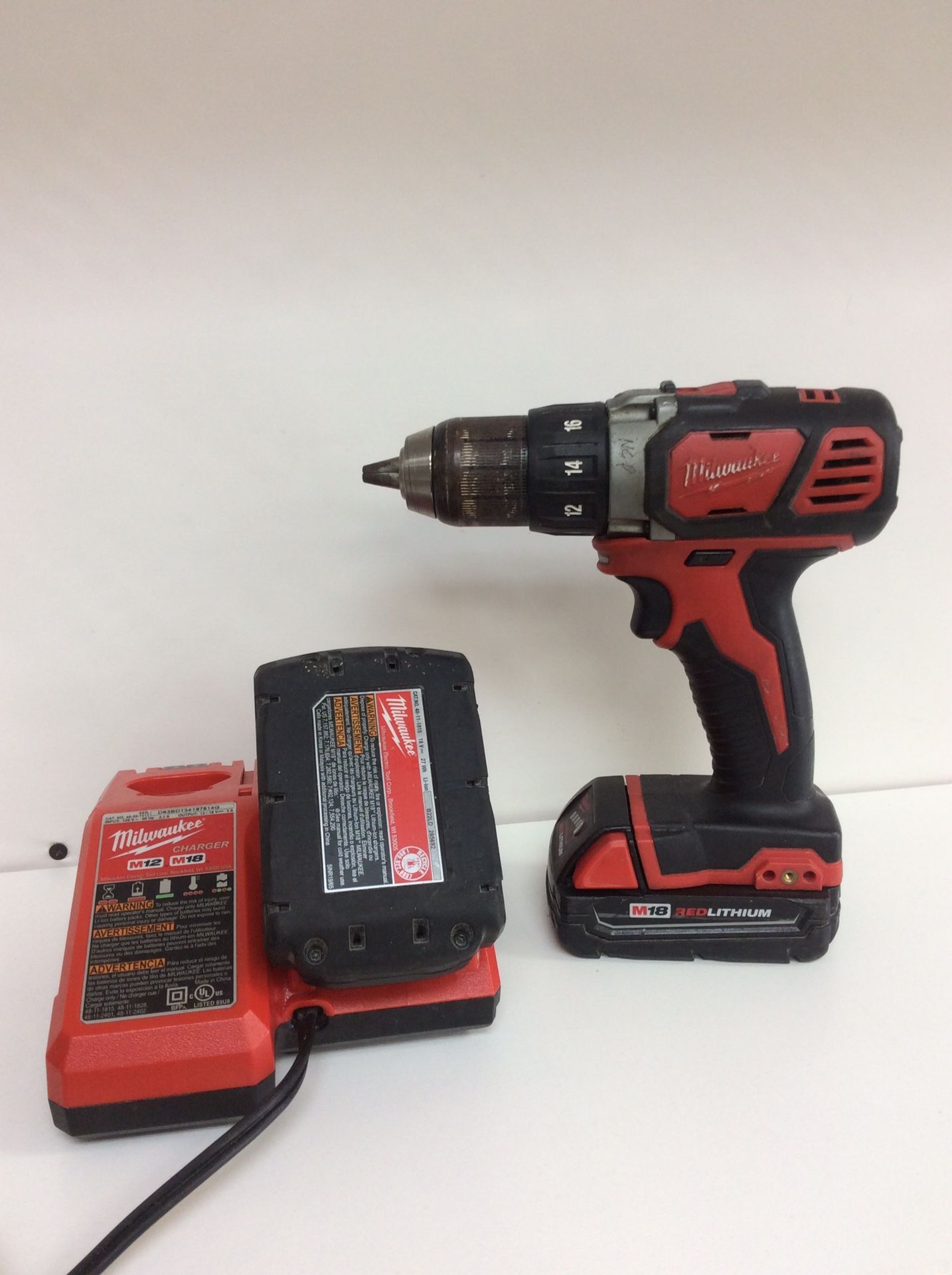 Milwaukee drill with two batteries and charger