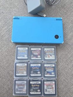 Nintendo blue DSi with 9 games and charger and stylus