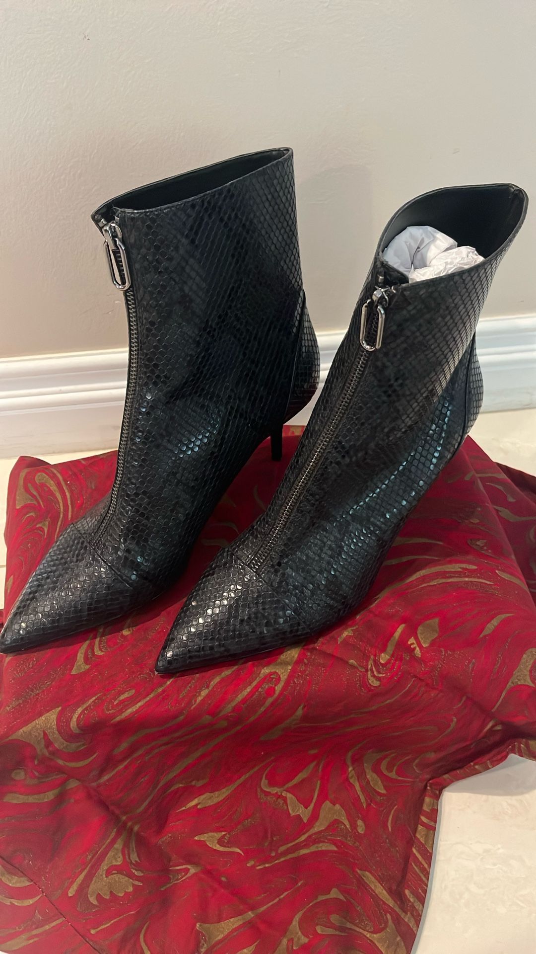Zara snakeskin heeled booties with zipper, $57