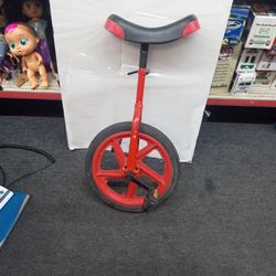 Red unicycle ready to ride