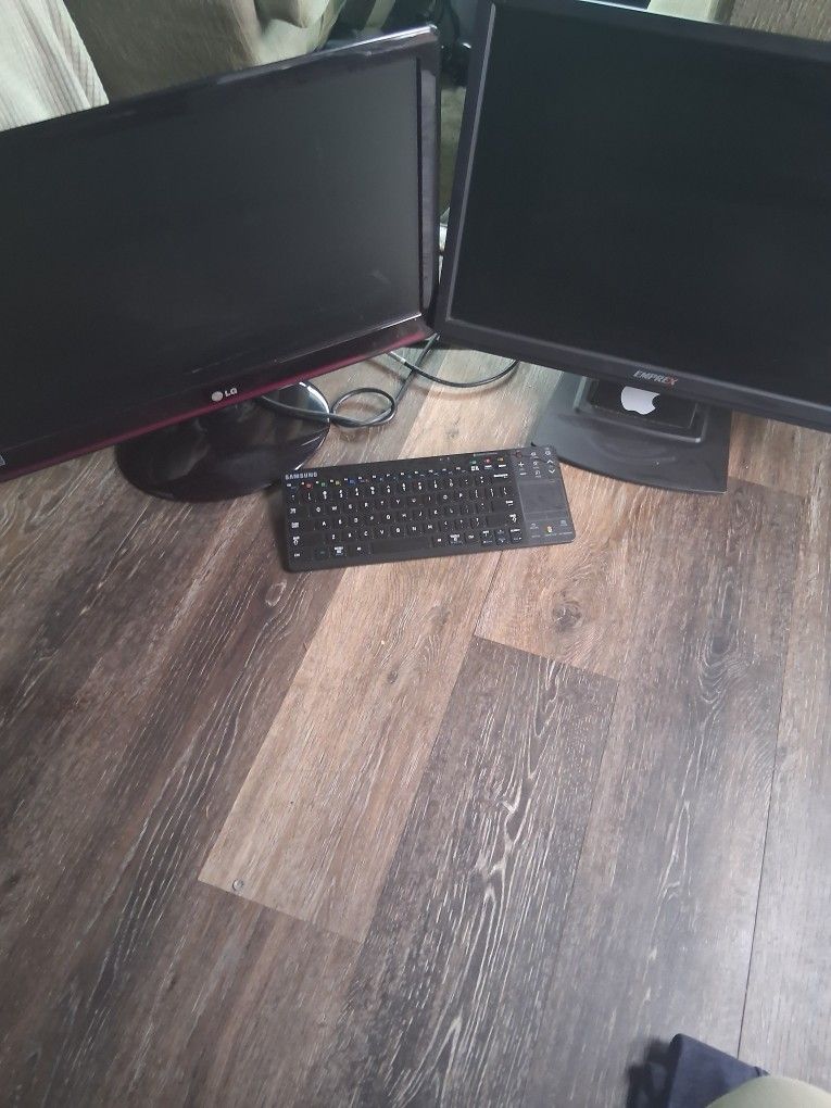 2 computer monitors and keyboard. $20