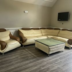 Leather Sectional  Cream And Taupe With Matching Ottoman ( Custom Glass To Use As A Cocktail Table) And Matching Chair 