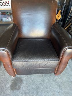 Brown leather recliner armchair